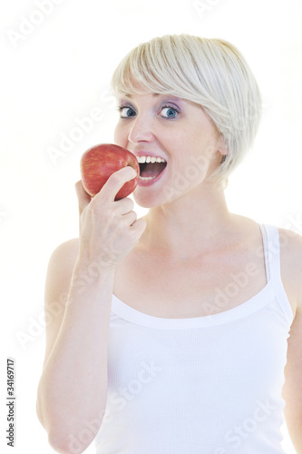 happy young woman eat green apple isolated on white
