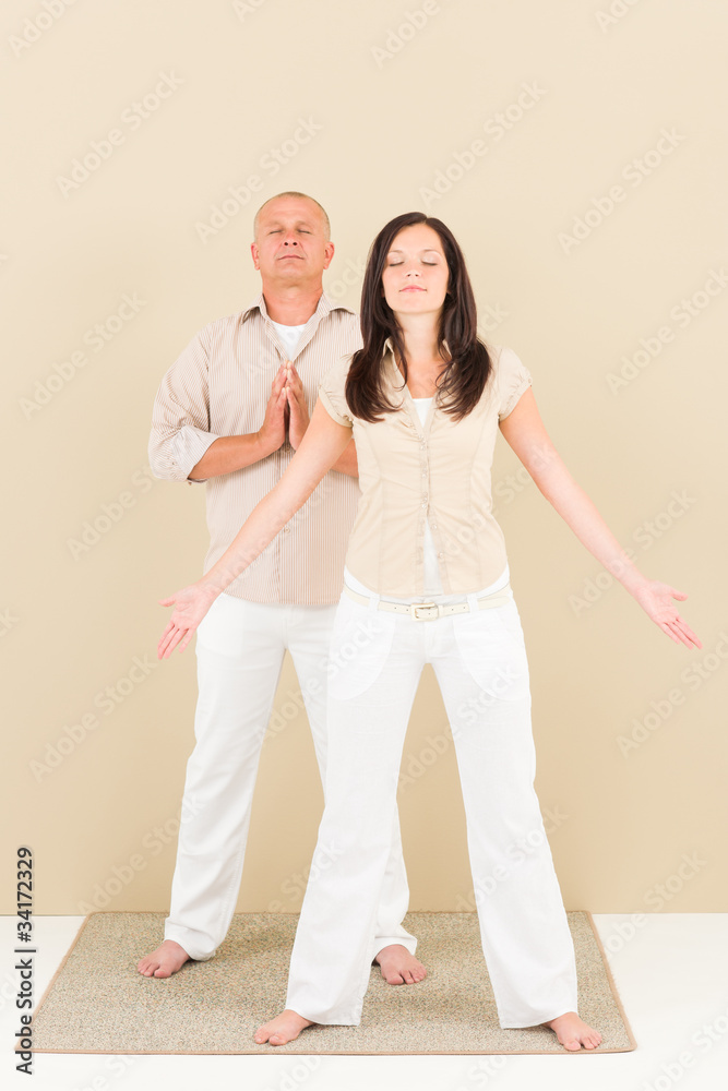 Casual business yoga pose businesspeople standing Casual business yoga pose businesspeople standing