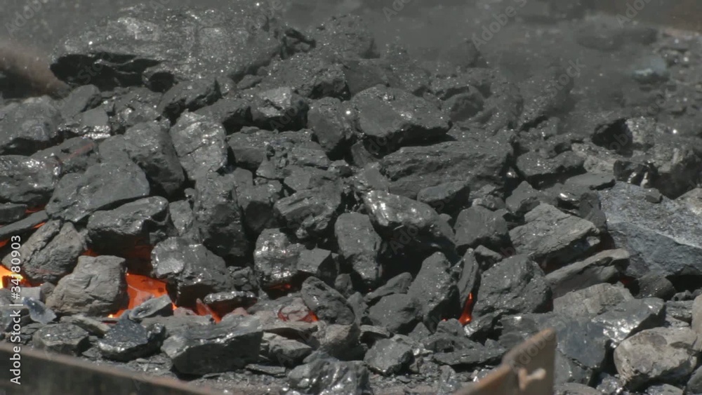 Covering glowing embers with coal Covering glowing embers with coal