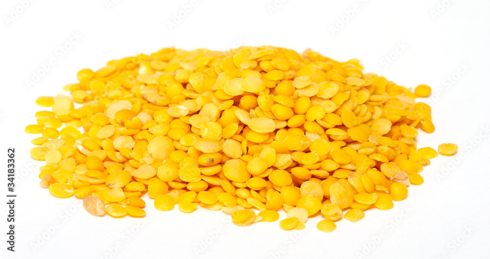 Yellow lentils isolated on white background.Macro shot Yellow lentils isolated on white background.Macro shot