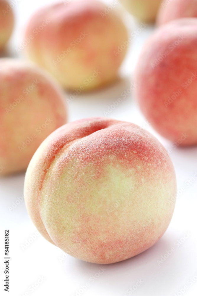 fresh white peaches on white background fresh white peaches on white background