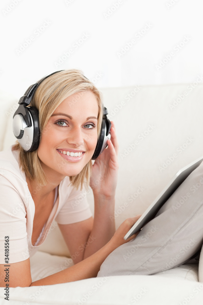 Portrait of a woman with a tablet computer and headphones Portrait of a woman with a tablet computer and headphones