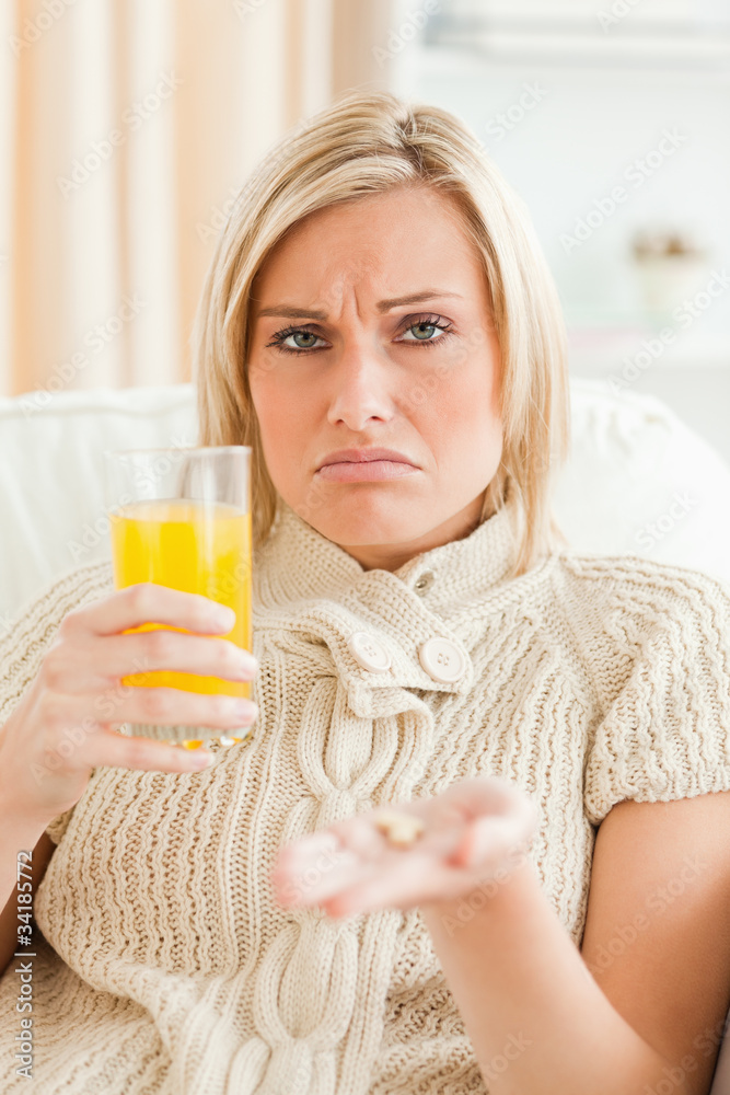 Sad woman showing pills Sad woman showing pills