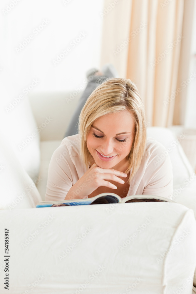 Portrait of a blonde woman reading a magazine Portrait of a blonde woman reading a magazine