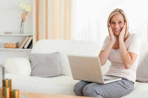 Happy woman with a laptop © WavebreakmediaMicro