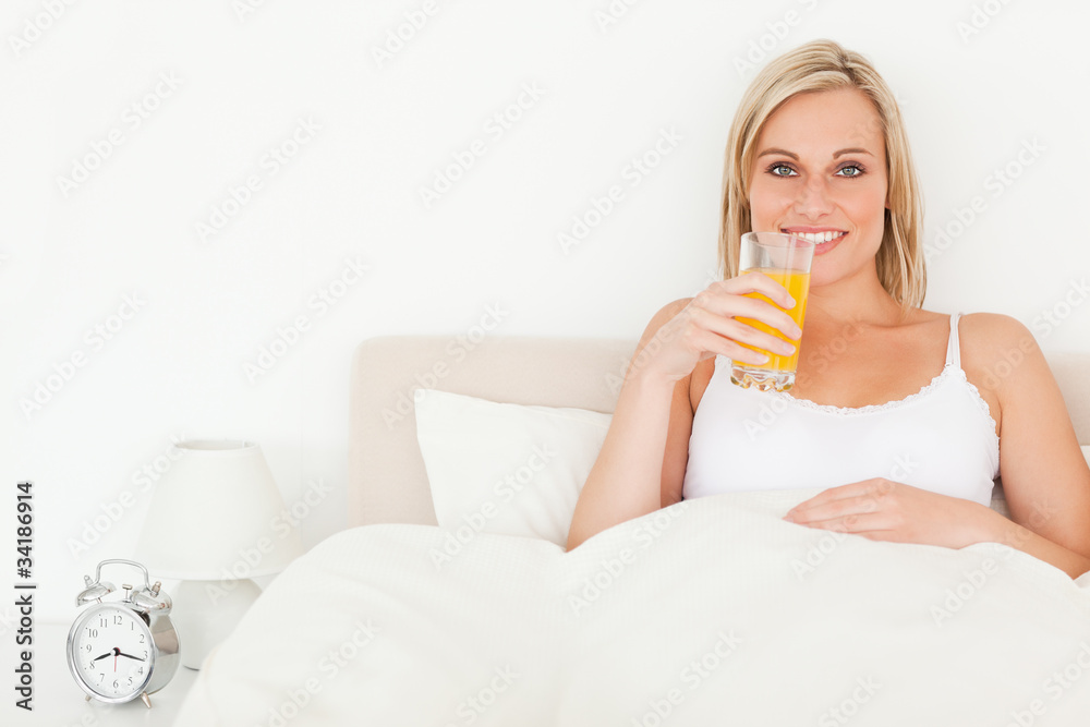 Woman drinking orange juice
