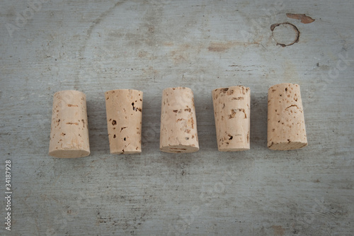 Cork stoppers on a wooden board