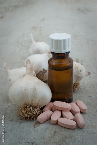 organic garlic, boottle and herbal pills