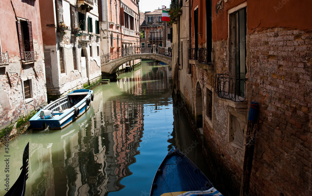 Shady Venetian canal, Italy.
