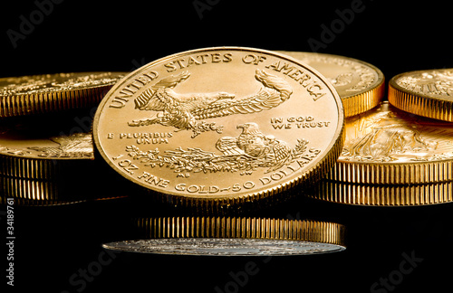 Macro image of gold eagle coin on stack