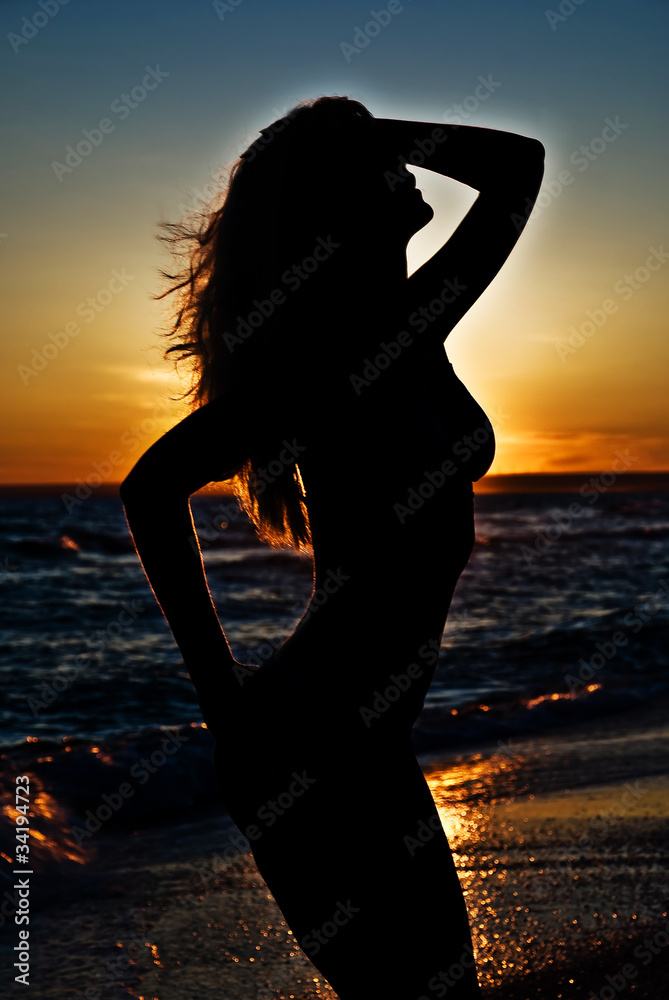 svelte girl silhouette against the sunset