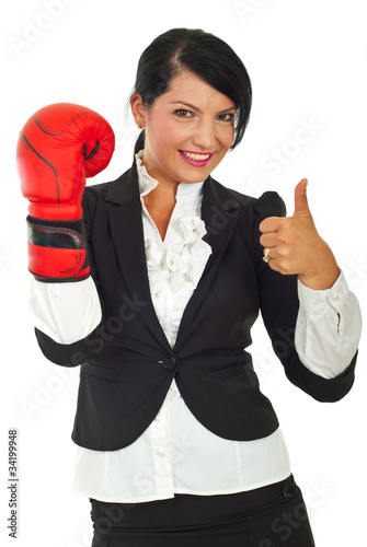 Successful business woman with boxing glove photo