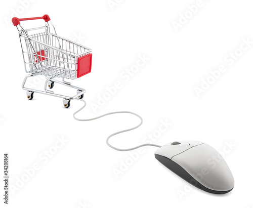 Internet shopping. Computer mouse and shopping cart.