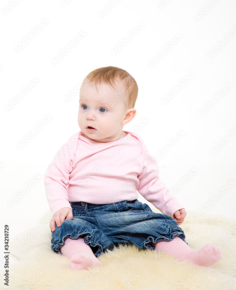 eight-monthly girl in a pink jacket and jeans eight-monthly girl in a pink jacket and jeans
