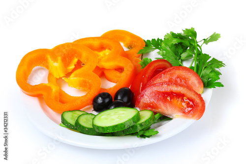 tasty vegetable salad on plate isolated on white