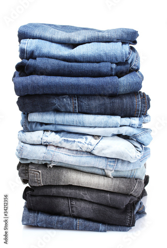 lot of blue jeans isolated on white