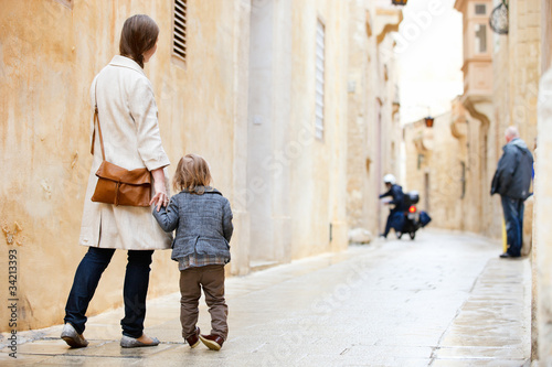 Mother and daughter in city