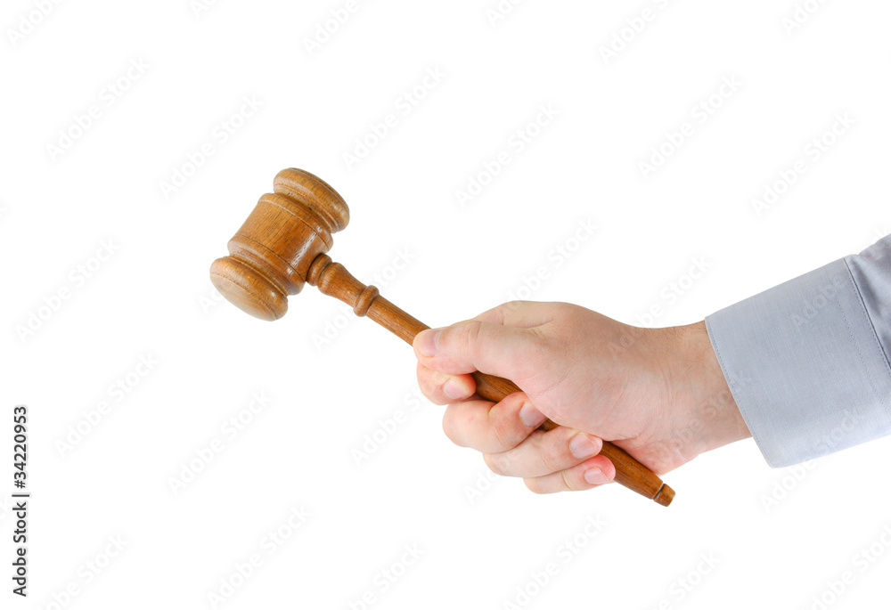 Judge's gavel in hand isolated on white