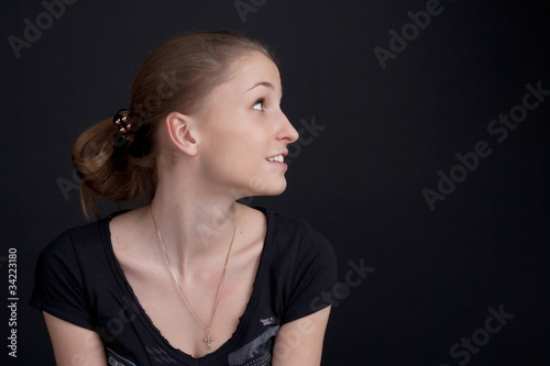 Smiling girl sitting in profile