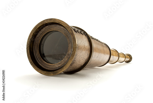 Closeup of antique spyglass, isolated on white.