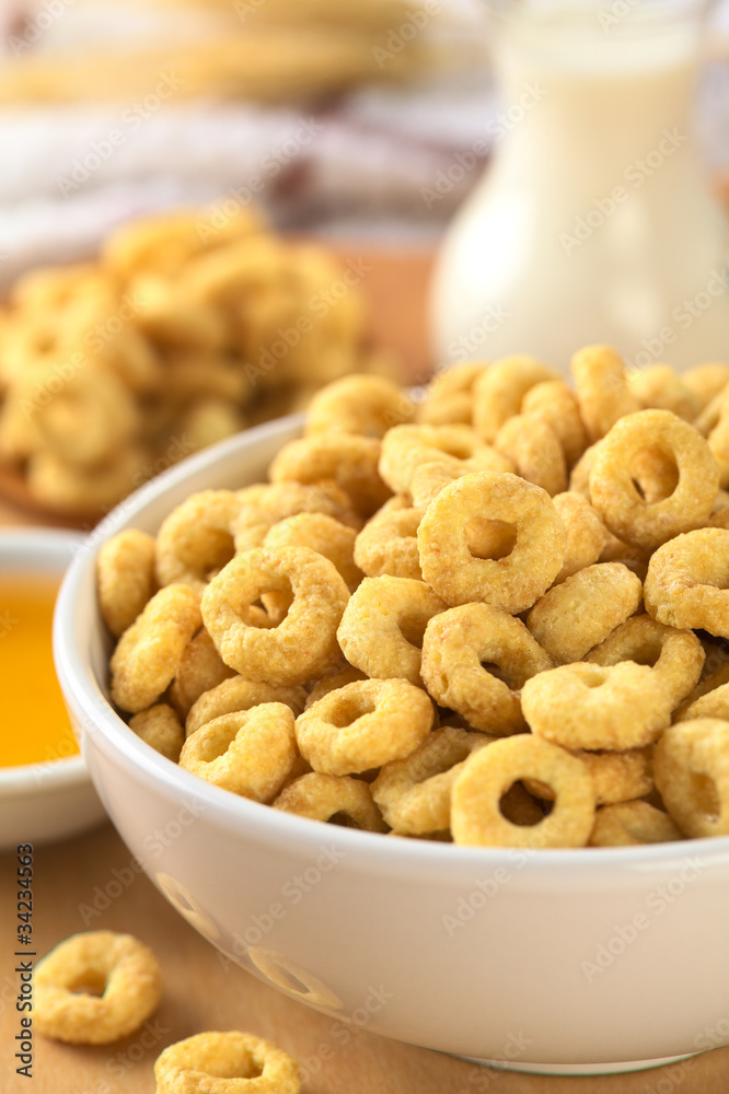 A bowl full of honey flavored cereal loops A bowl full of honey flavored cereal loops