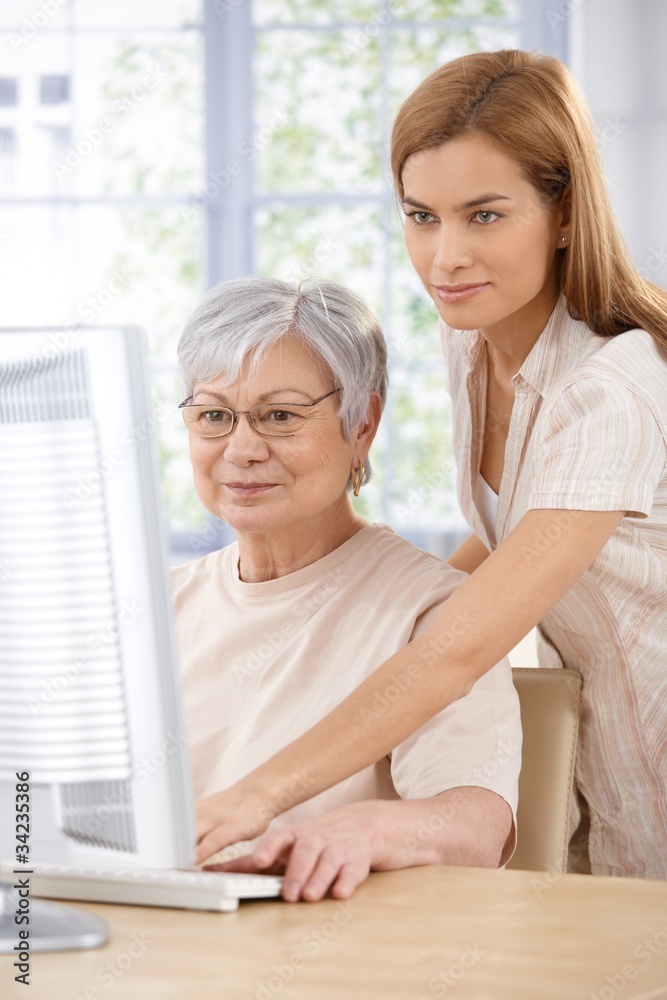 Mother and daughter browsing internet Mother and daughter browsing internet