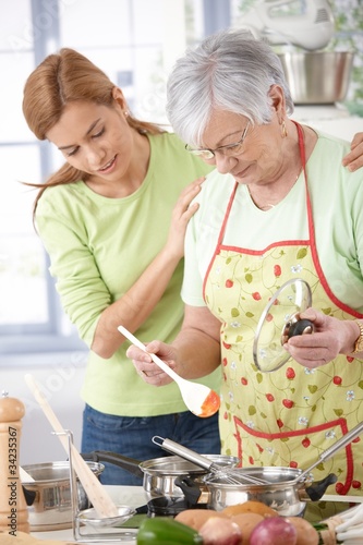 Senior mother cooking with daughter