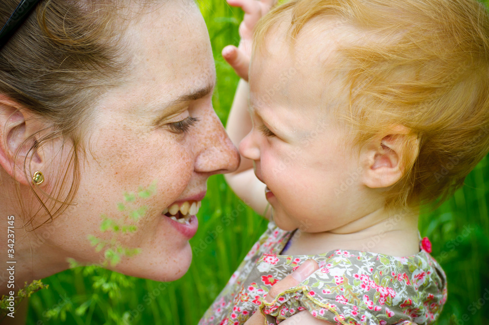 Portrait of mother and her little baby playing - outdoors Portrait of mother and her little baby playing - outdoors