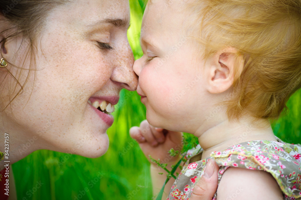 Portrait of mother and her little baby playing - outdoors Portrait of mother and her little baby playing - outdoors