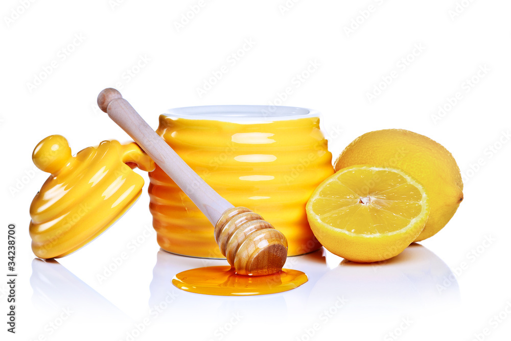 Honey and lemon isolated on a white background. Honey and lemon isolated on a white background.