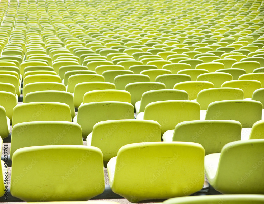 Fototapeta premium Empty plastic seats at stadium, open door sports arena