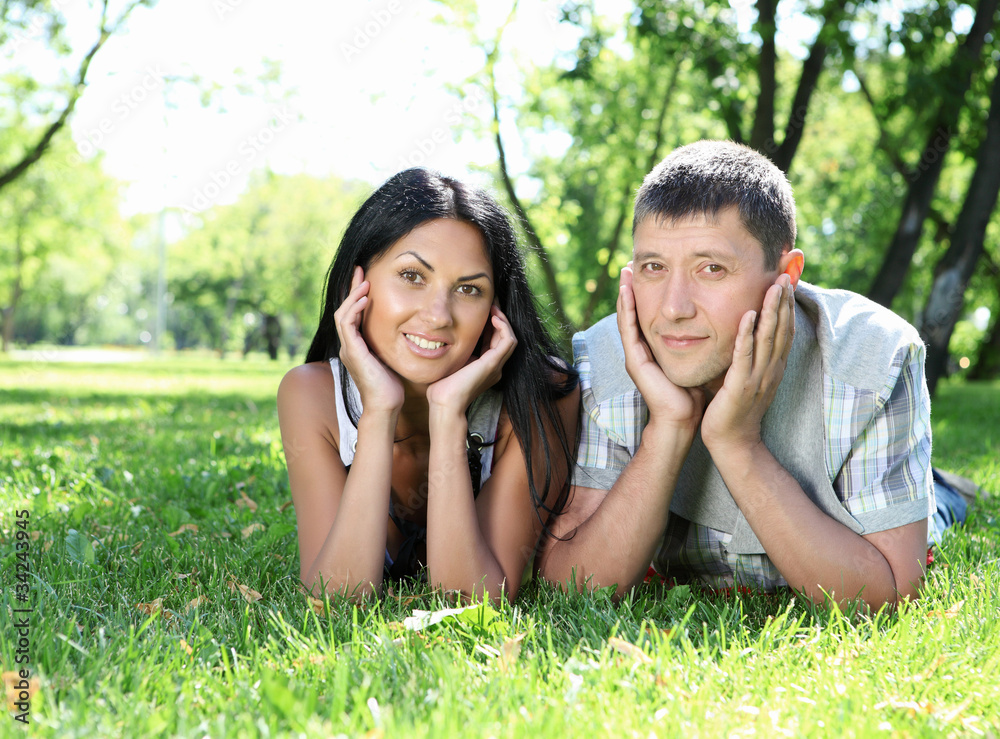 couple spending time together in the summer park couple spending time together in the summer park