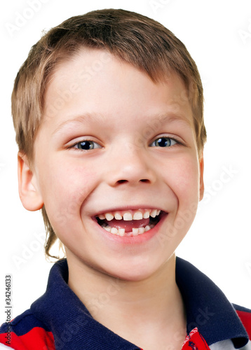 Funny happy child without one tooth on white background