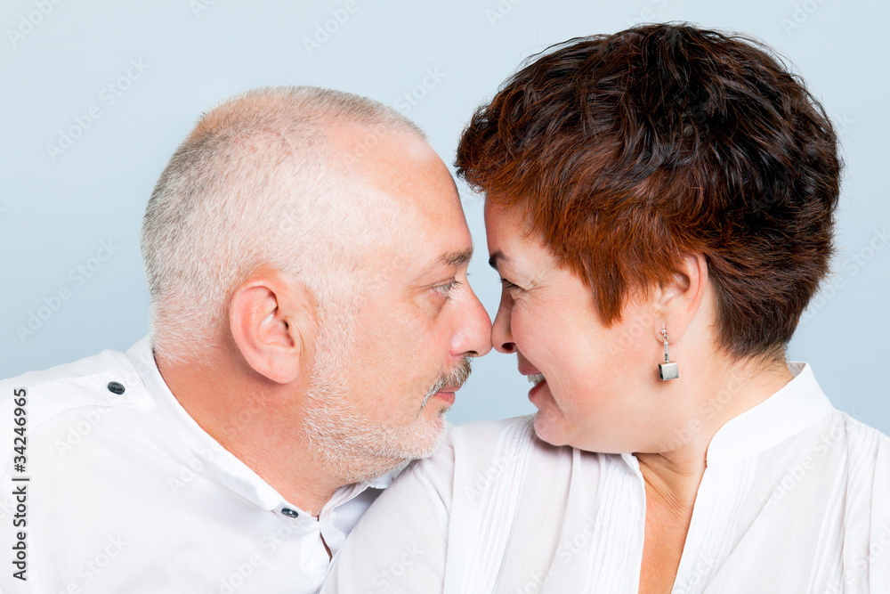 A loving couple smiling at each other. A loving couple smiling at each other.
