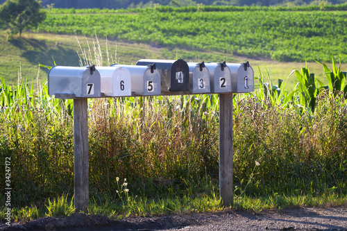 Photos Seven mail boxes on a country road