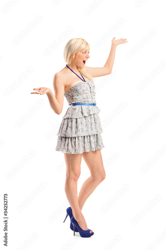 Fototapeta premium Surprised young woman with hands over her