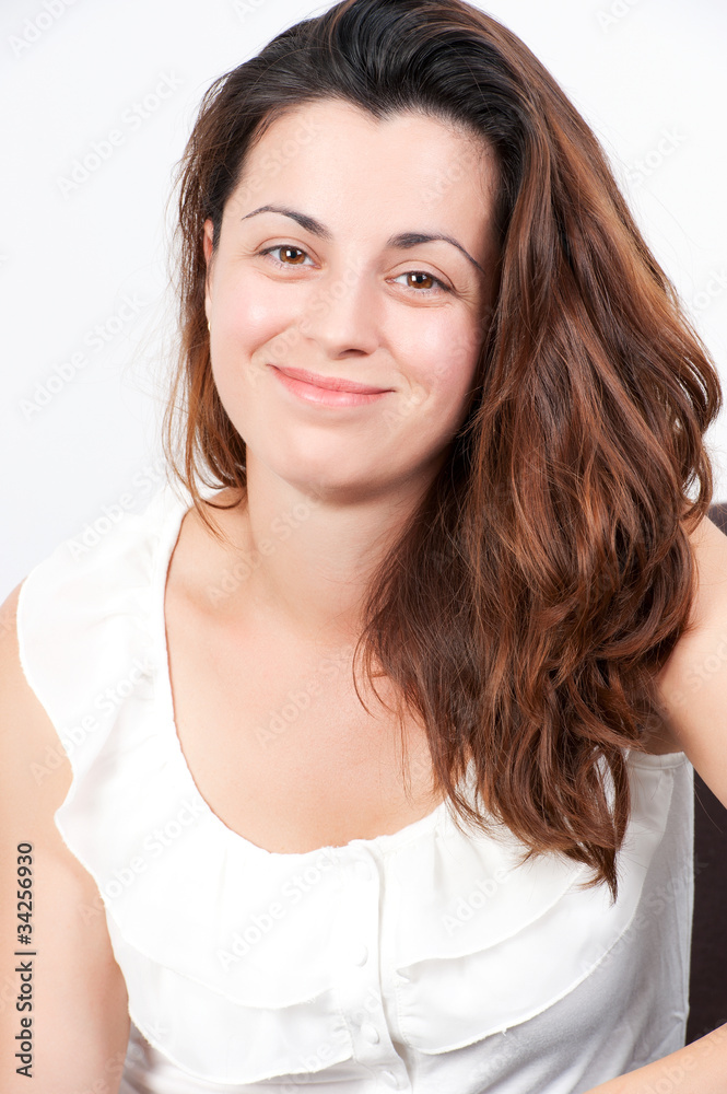 Portrait of casually dressed young woman smiling Portrait of casually dressed young woman smiling