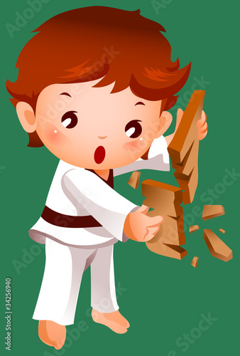 Boy breaking a board using karate