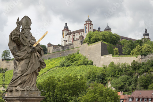 statue mit blick auf die festung marienberg in würzburg photo