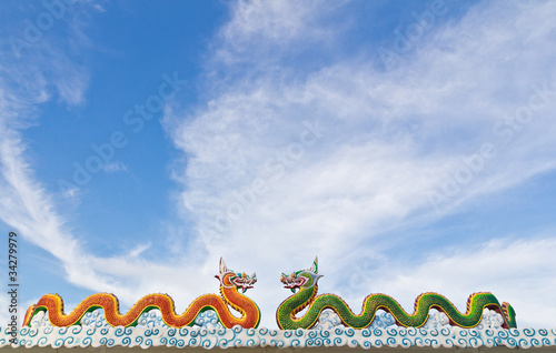 Green and red naga statue