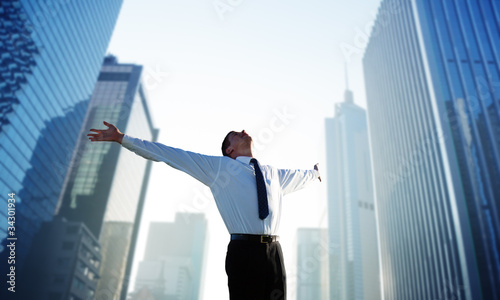happy young businessman and big city photo