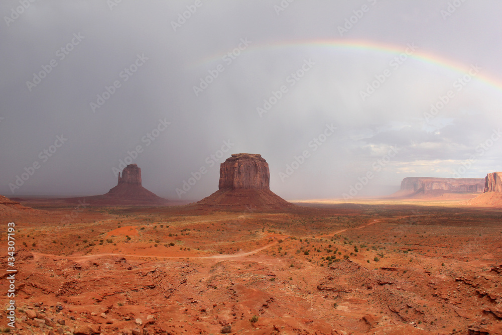 Rainbow and Storm Over Monument Valley - Arizona