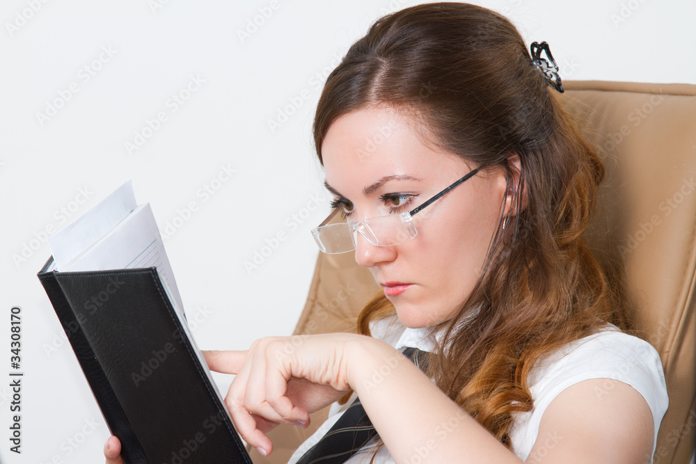 beautiful girl-student in glasses reading a book beautiful girl-student in glasses reading a book