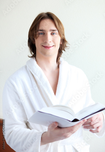 portrait of a young man in bath robe photo