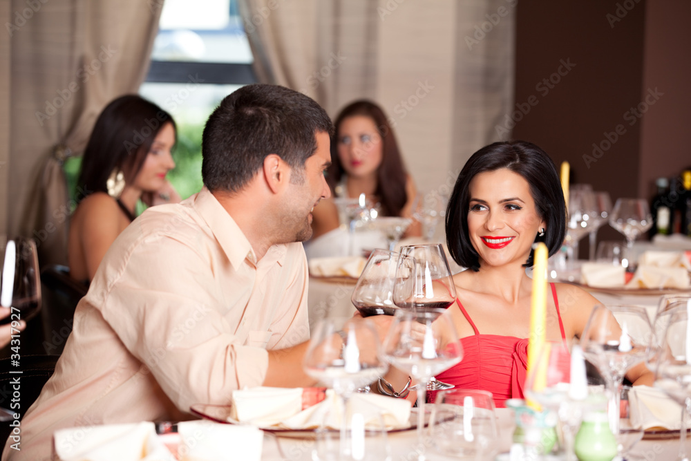 young couple toasting restaurant table young couple toasting restaurant table