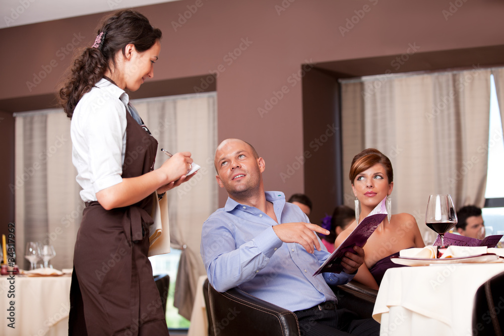Obraz premium waitress taking the order from restaurant table