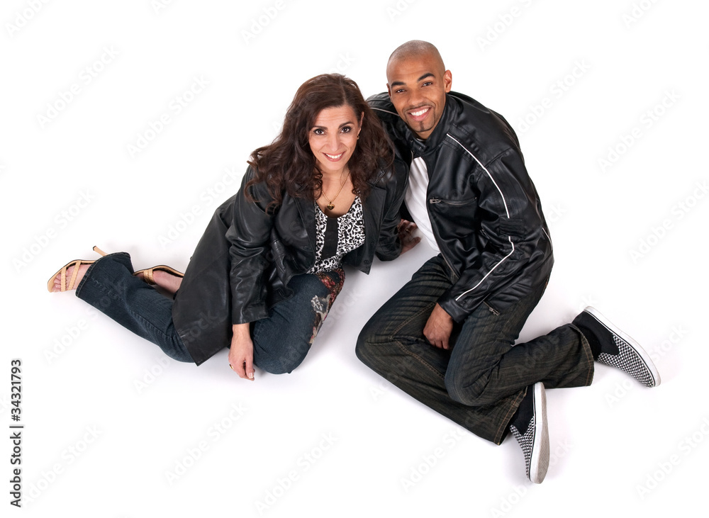 Happy man and woman sitting close to each other