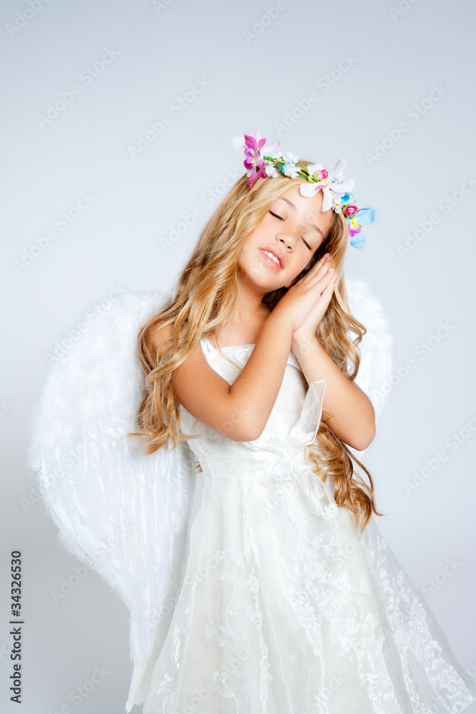 Angel children blond girl with sleeping hands gesture Angel children blond girl with sleeping hands gesture