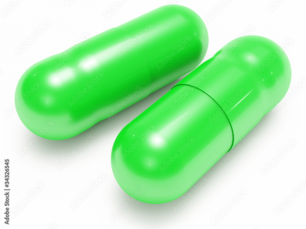 Two shiny green pills (medical capsules)