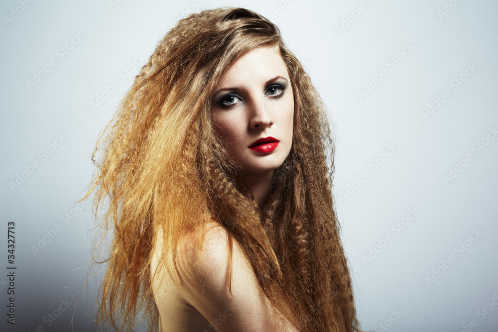 Fashion portrait of a young beautiful redhead woman Fashion portrait of a young beautiful redhead woman